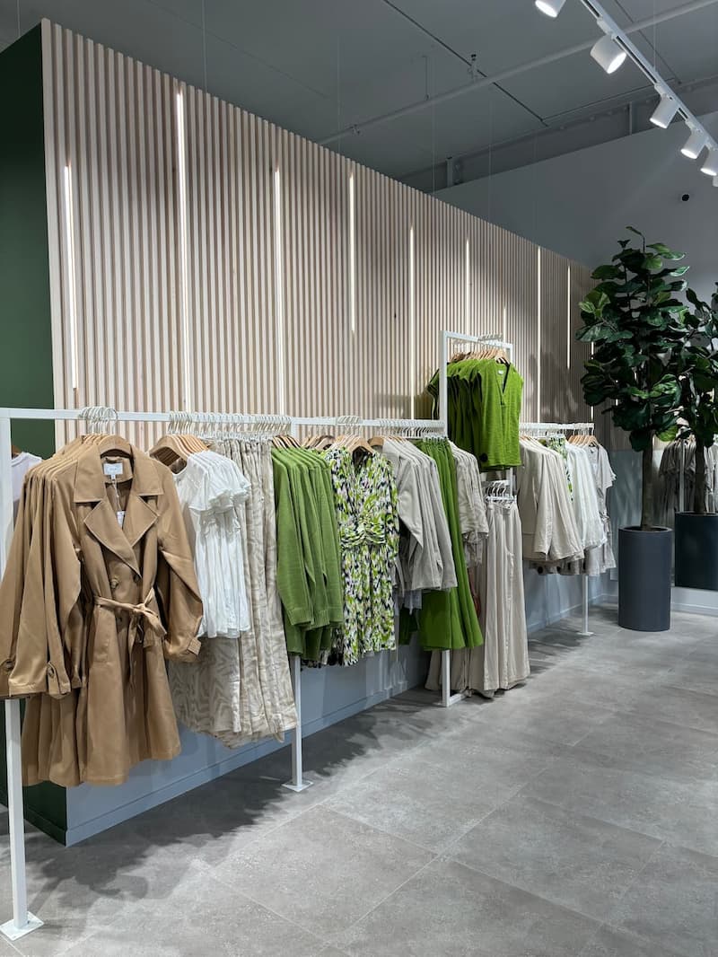 VILA Amsterdam. Wooden panels with LED behind clothes rack